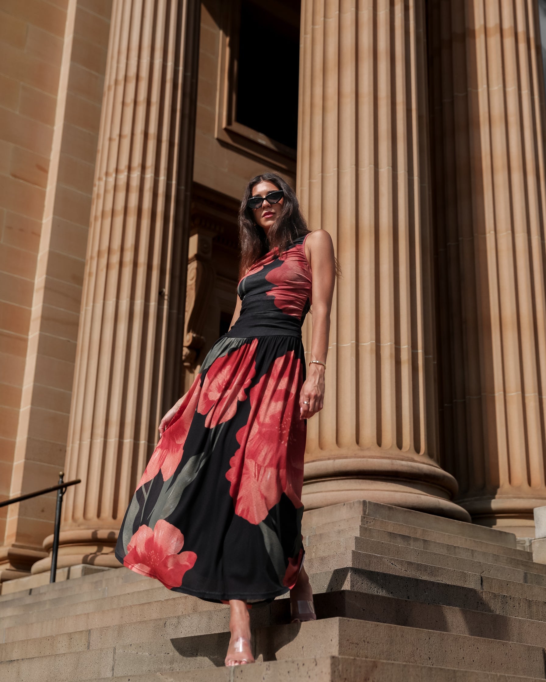 Women's black floral maxi dress with bold red floral print, boat neckline and flowy maxi skirt, the Balayage Dress in Black Floral by Esther & Co