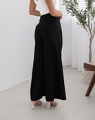 Women's black high waisted pants with button and zip closure by Esther & Co