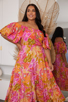 Axelle Dress in Sunset Print sunset abstract print midi dress side view