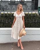 Celie beige linen midi dress with frill skirt, styled view