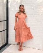 Celie rust tiered linen midi dress, styled view