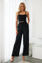 Front view of the women's black sweetheart neckline crop top by Esther & Co