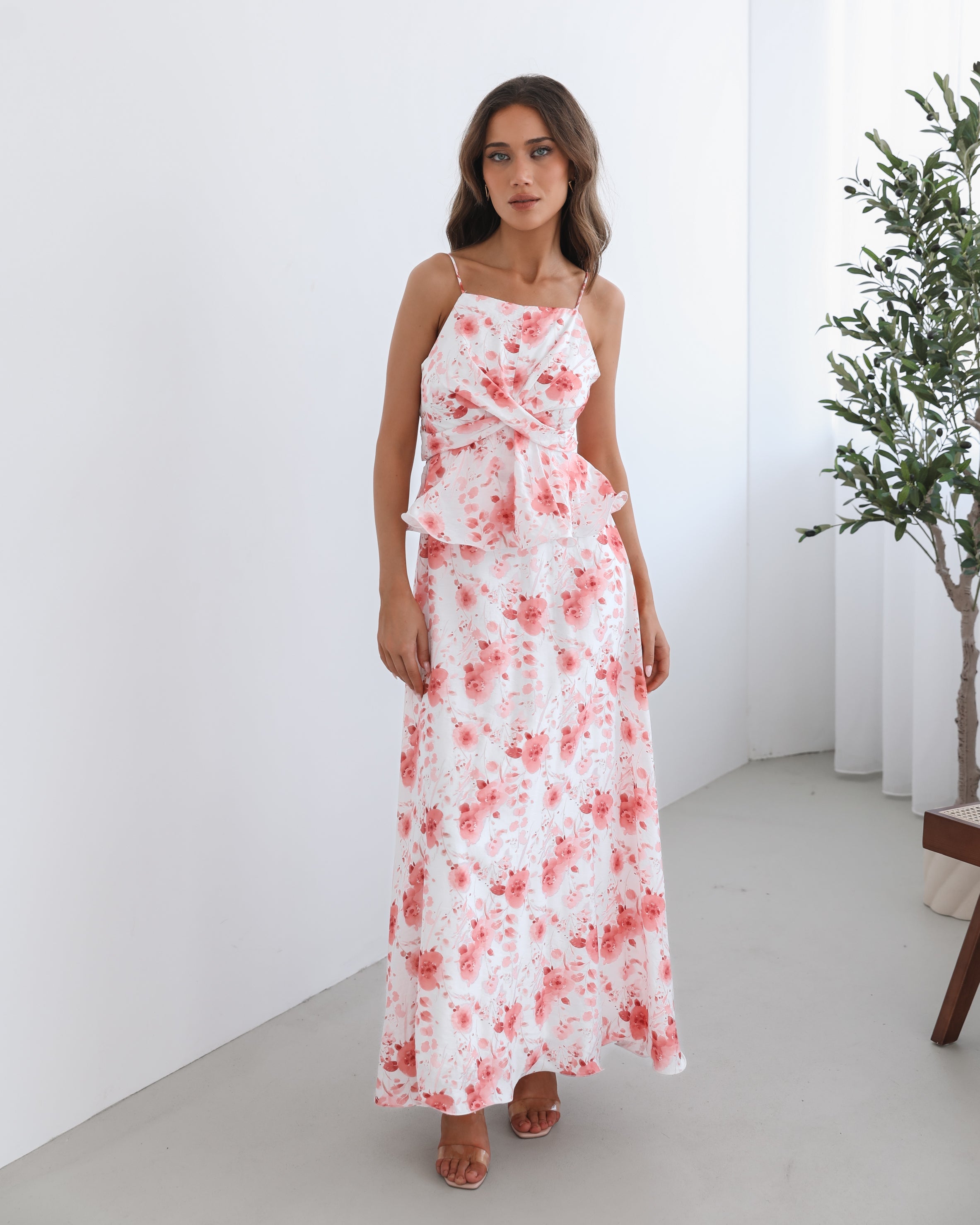 Women's white floral maxi dress styled for a garden party by Esther & Co