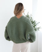 Front view of the Dorine Cardigan in Forest Green showing the textured knit and relaxed fit