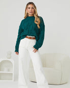 Front view of the Hadi Dark Green Knit showing the high round neckline and relaxed textured knit