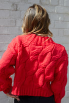 Hadi red knit jumper with high round neckline, styled view