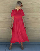 Women's flowy cherry red cotton dress styled for day to evening by Esther & Co