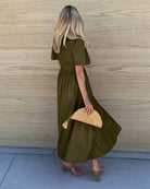 Women's flowy dark olive cotton dress styled for day to evening by Esther & Co