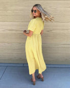 Women's flowy yellow cotton dress with vertical pinstripe texture by Esther & Co