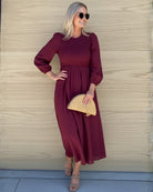 Front view of the Iolana Wine Long Sleeve Midi Dress showing the round neckline and textured A-line fit