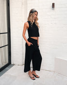 Lighthouse black linen pants styled with a top