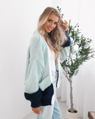 Sheona sage multi cardigan worn over white top