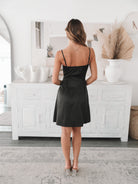 Women's black mini dress with flowy skirt by Esther & Co