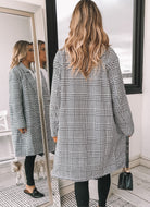 Front view of the Polaris Plaid Longline Coat showing the button-up front and collar detail